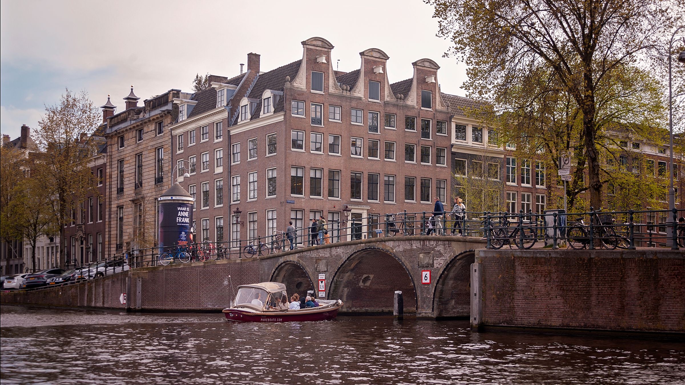 Board table with papers and a laptop in an Amsterdam canal-house office